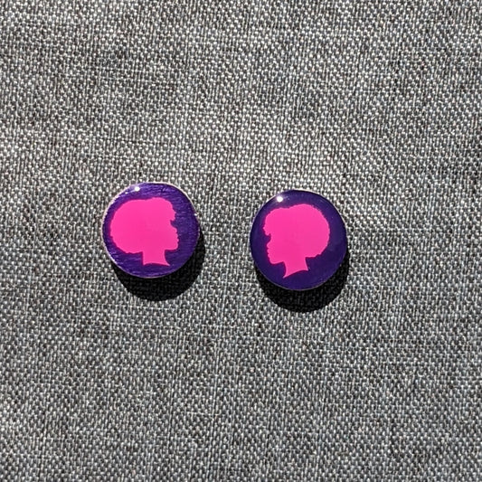 Purple and pink 1.5" diameter round stud earrings. Purple background with Pink Afro Woman applique. 