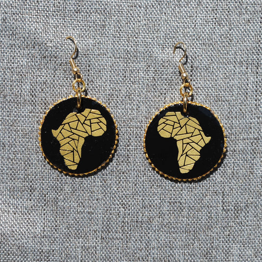 Black and gold 1.5" diameter round earrings. Painted black background with gold Africa applique. Gold colored metal hooks.