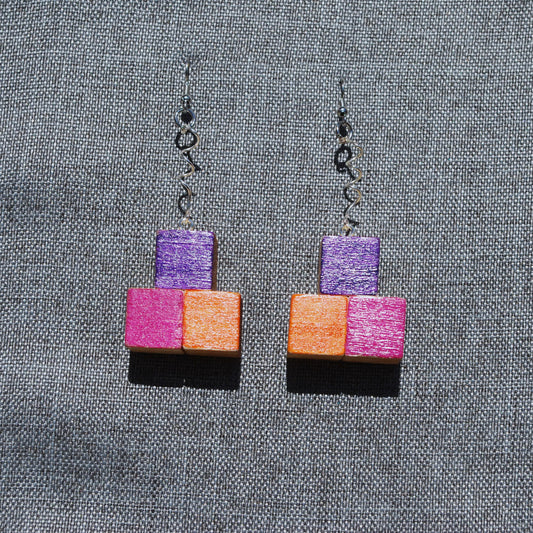 Purple, Pink, and Orange earring. Spiraled metal connector. Total length 2.5". Silver colored metal hooks and connector.