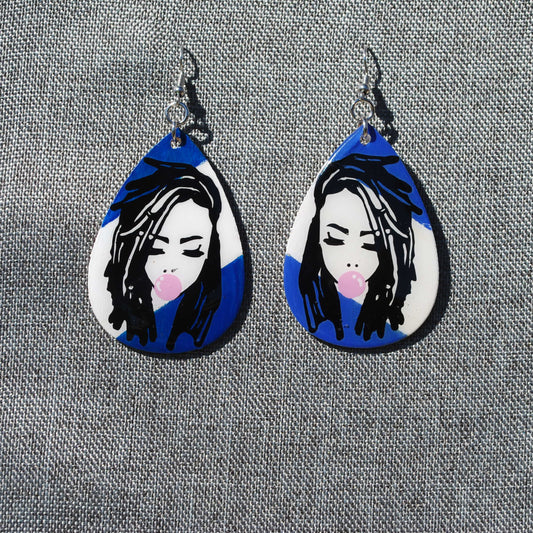 Blue and white teardrop shaped earring.  Length 2". Loc'd woman with bubble gum applique.