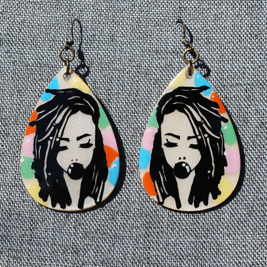 Teardrop shaped earring.  Length 2". Loc'd woman with bubble gum applique. Hand painted multicolor bubble gum background